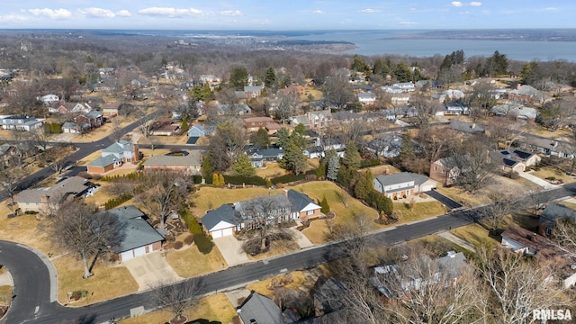 bird's eye view with a water view and a residential view