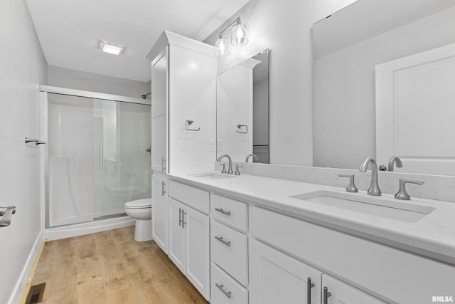 1109 Lawson St, Washington, IL 61571 - full bathroom featuring a stall shower, double vanity, and wood finished floors