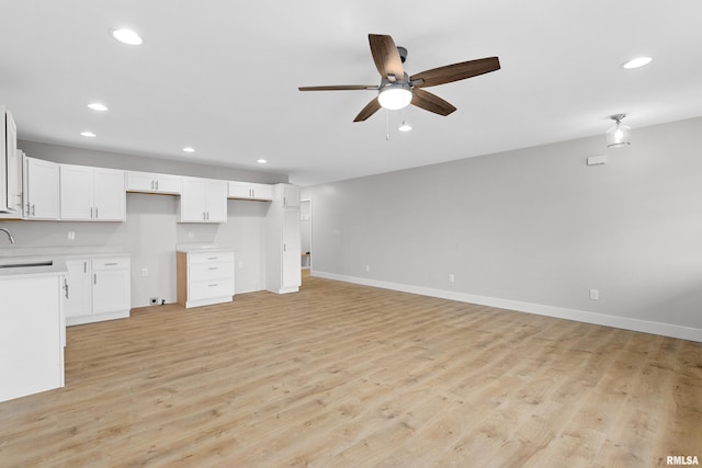 1109 Lawson St, Washington, IL 61571 - unfurnished living room featuring a ceiling fan, recessed lighting, and light wood-style floors