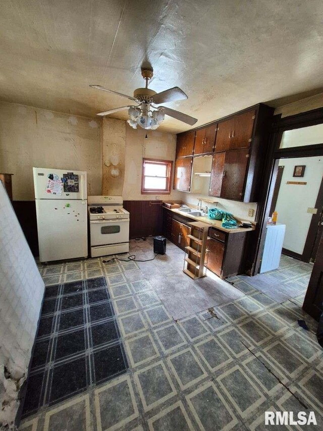 kitchen with tile patterned floors, light countertops, a sink, white appliances, and ceiling fan