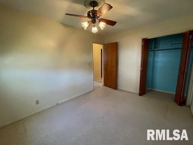 unfurnished bedroom with a ceiling fan, baseboards, a closet, and light colored carpet
