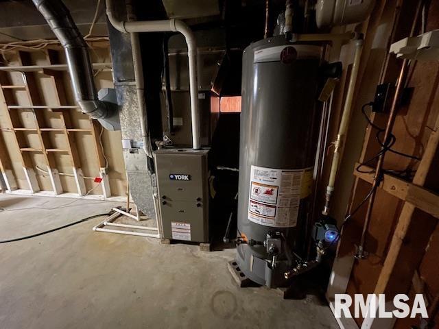utility room with gas water heater and heating unit