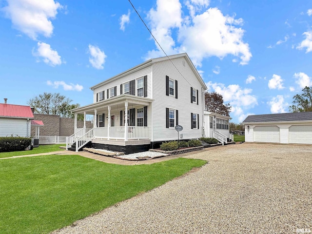 370 W Carter St, Fairview, IL 61432 - view of front of home with a porch, an outbuilding, a front yard, and a garage