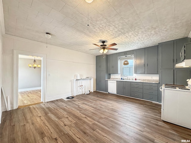 370 W Carter St, Fairview, IL 61432 - kitchen with under cabinet range hood, light countertops, white appliances, gray cabinetry, and hardwood / wood-style flooring