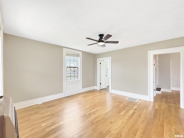 370 W Carter St, Fairview, IL 61432 - spare room featuring ceiling fan, baseboards, light wood finished floors, and visible vents