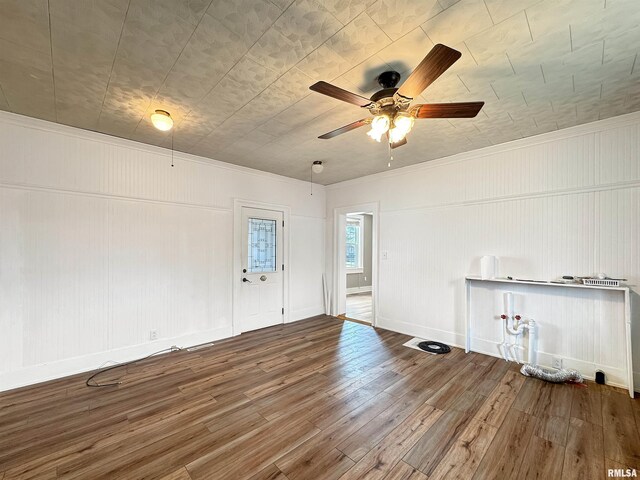 370 W Carter St, Fairview, IL 61432 - empty room with crown molding, wood finished floors, a ceiling fan, and baseboards