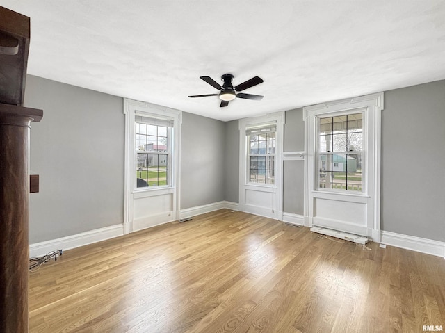 370 W Carter St, Fairview, IL 61432 - spare room featuring baseboards, wood finished floors, and a wealth of natural light