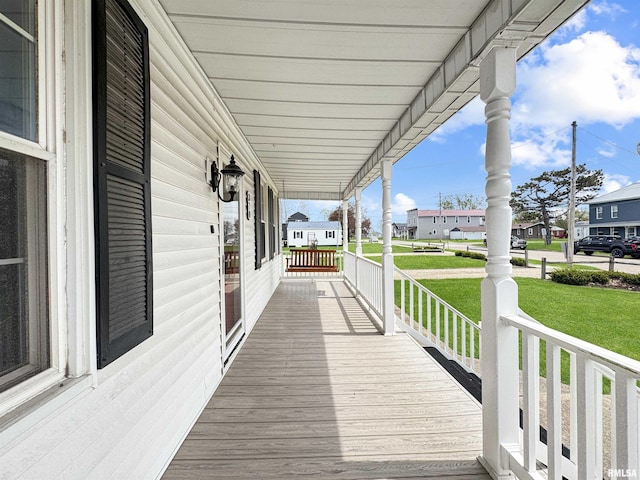 370 W Carter St, Fairview, IL 61432 - wooden deck with a yard, a residential view, and covered porch