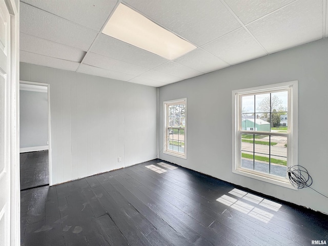 370 W Carter St, Fairview, IL 61432 - unfurnished room featuring a paneled ceiling and dark wood-style floors