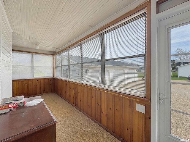 370 W Carter St, Fairview, IL 61432 - unfurnished sunroom featuring wood walls and tile patterned floors