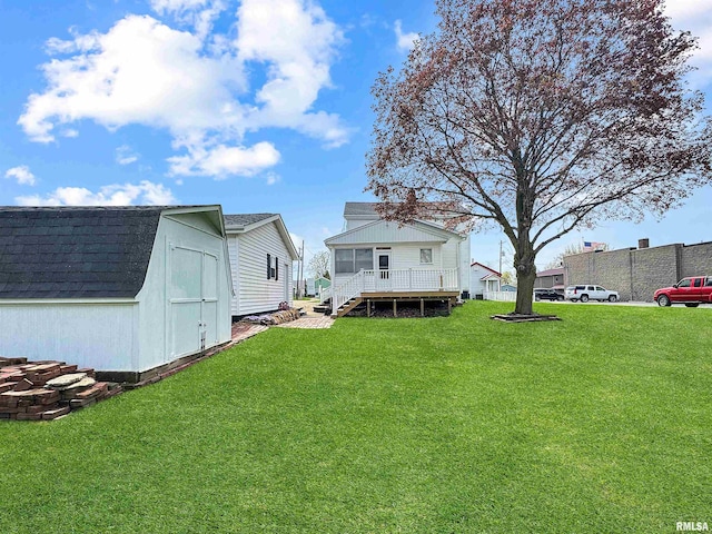 370 W Carter St, Fairview, IL 61432 - view of yard with stairway, a storage shed, an outdoor structure, a wooden deck, and a sunroom