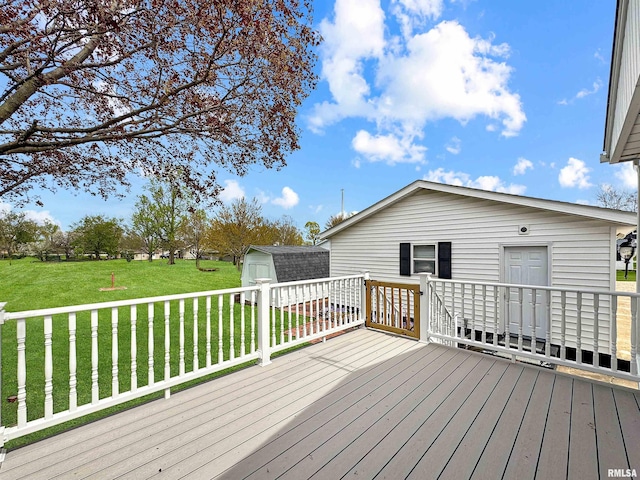 370 W Carter St, Fairview, IL 61432 - wooden terrace featuring an outbuilding, a yard, and a storage shed