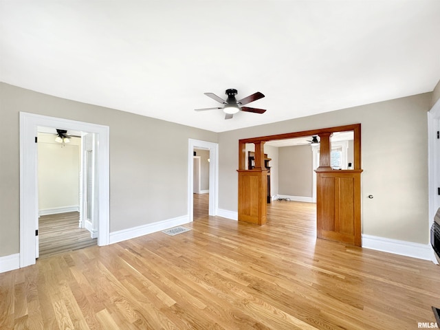 370 W Carter St, Fairview, IL 61432 - unfurnished living room with baseboards, visible vents, light wood-style floors, and ceiling fan