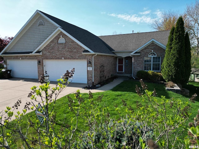 112 W Hillside Ct, Dunlap, IL 61525 - view of front facade with driveway, an attached garage, brick siding, and a front yard