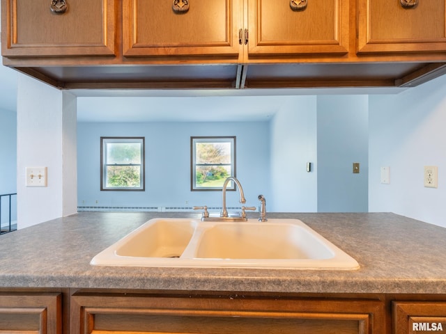 1024 Florence Ave, Pekin, IL 61554 - kitchen with a sink, dark countertops, and brown cabinets