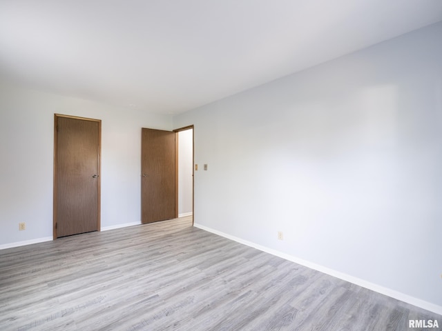 1024 Florence Ave, Pekin, IL 61554 - unfurnished bedroom featuring light wood-type flooring and baseboards