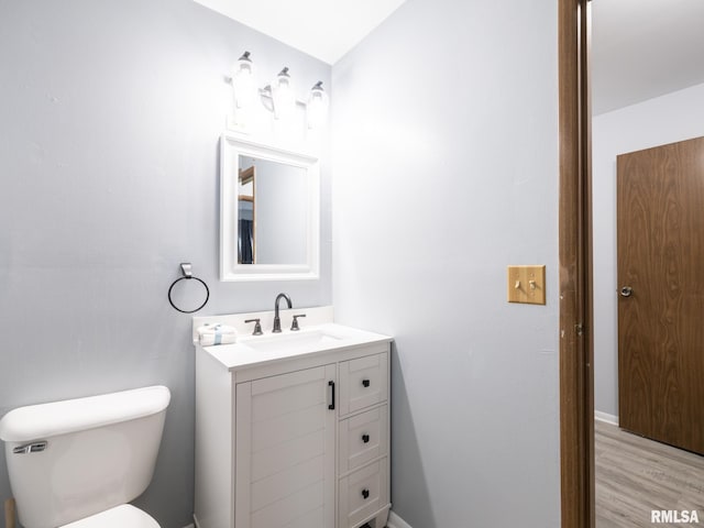 1024 Florence Ave, Pekin, IL 61554 - half bath with toilet, vanity, and wood finished floors