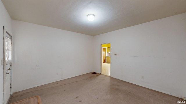 empty room with carpet flooring