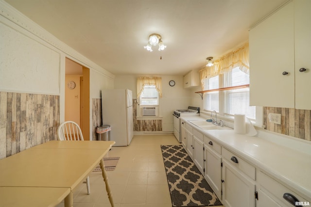 212 S Cone St, Farmington, IL 61531 - kitchen with white cabinets, white appliances, light countertops, and a sink