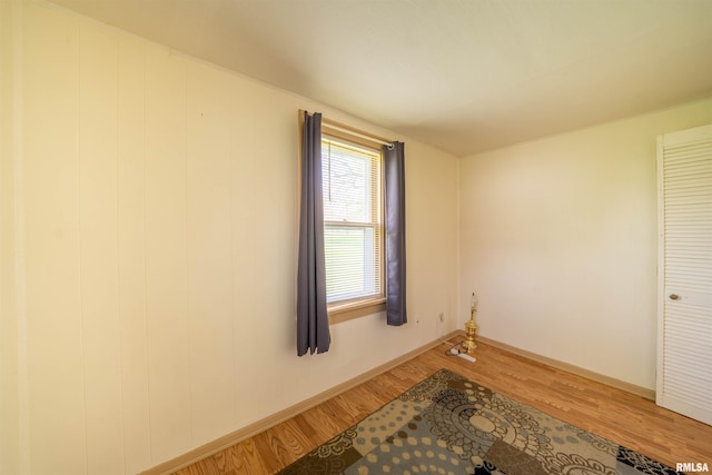 212 S Cone St, Farmington, IL 61531 - empty room with baseboards and light wood-type flooring