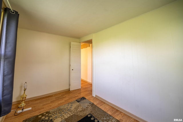 212 S Cone St, Farmington, IL 61531 - empty room with wood finished floors and baseboards