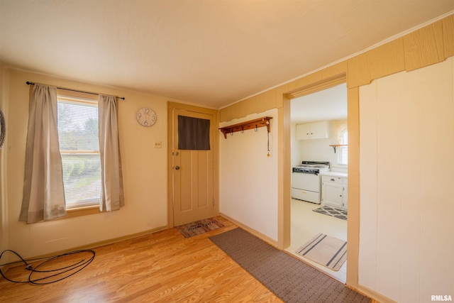 212 S Cone St, Farmington, IL 61531 - entryway featuring baseboards and light wood finished floors