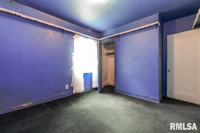 unfurnished bedroom with a closet and carpet