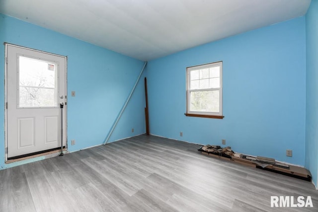 empty room with wood finished floors