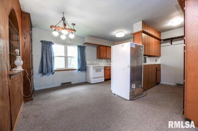 kitchen featuring visible vents, brown cabinets, carpet, and white appliances