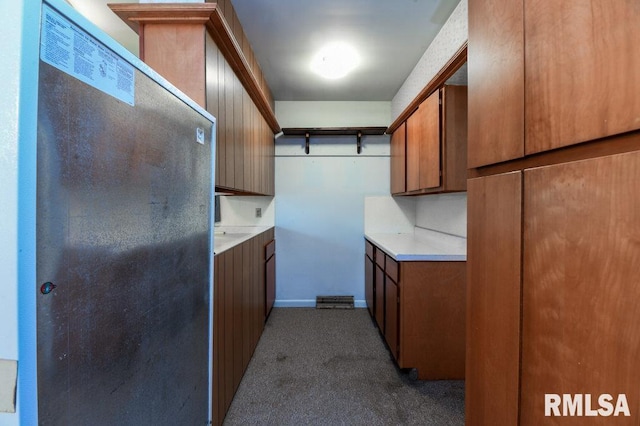 laundry area featuring carpet floors