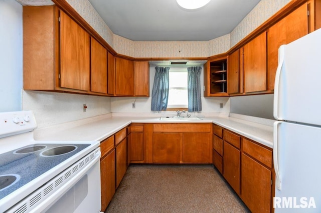 kitchen featuring brown cabinets, a sink, light countertops, wallpapered walls, and white appliances