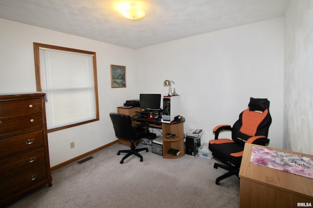 carpeted office space with baseboards and visible vents