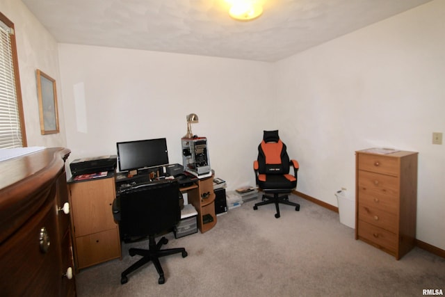 office area with baseboards and light carpet