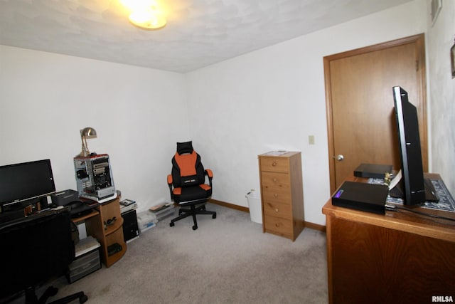 carpeted office featuring baseboards