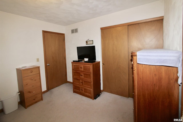 bedroom with light colored carpet and visible vents