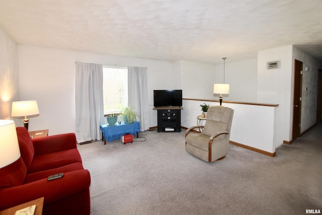 carpeted living room featuring visible vents and baseboards
