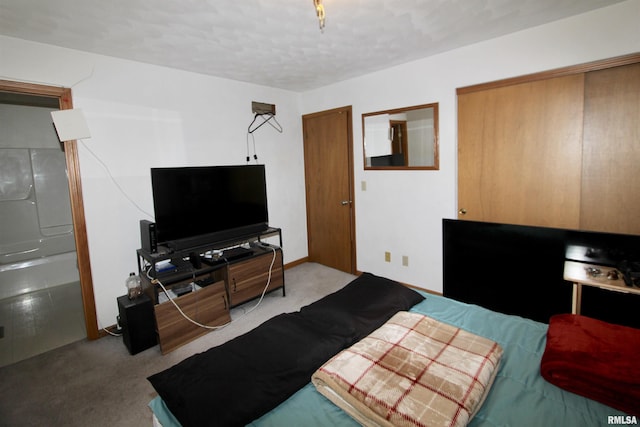 carpeted bedroom with a textured ceiling