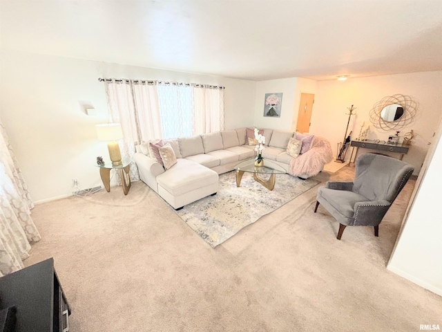 carpeted living room featuring visible vents and baseboards