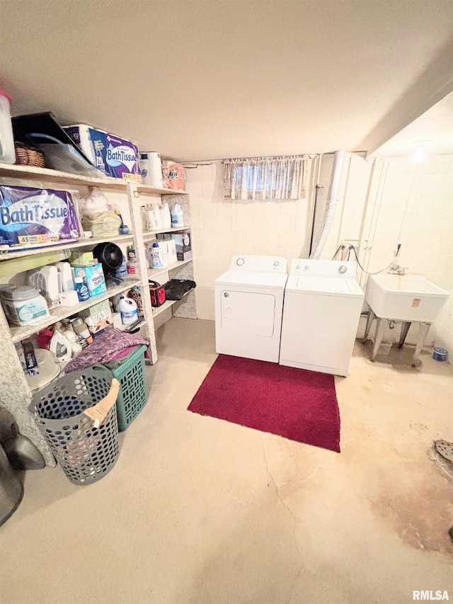 laundry area with washer and dryer, laundry area, and a sink