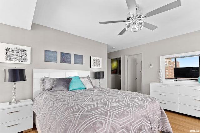 bedroom featuring a ceiling fan and light wood finished floors
