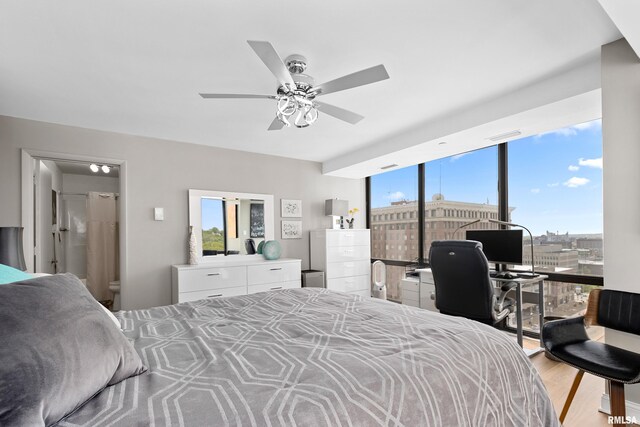 bedroom featuring light wood-type flooring and a ceiling fan