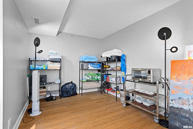 storage room with a toaster and visible vents