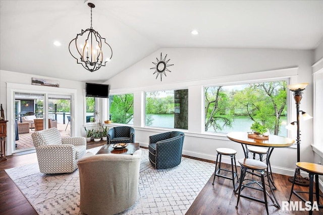 sunroom with plenty of natural light and a notable chandelier