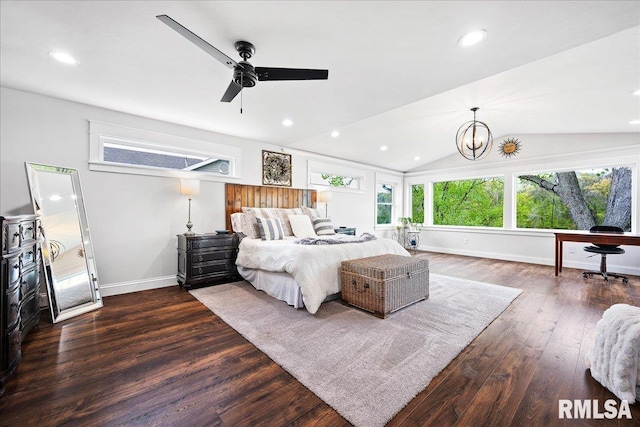 bedroom featuring baseboards, dark wood finished floors, and vaulted ceiling