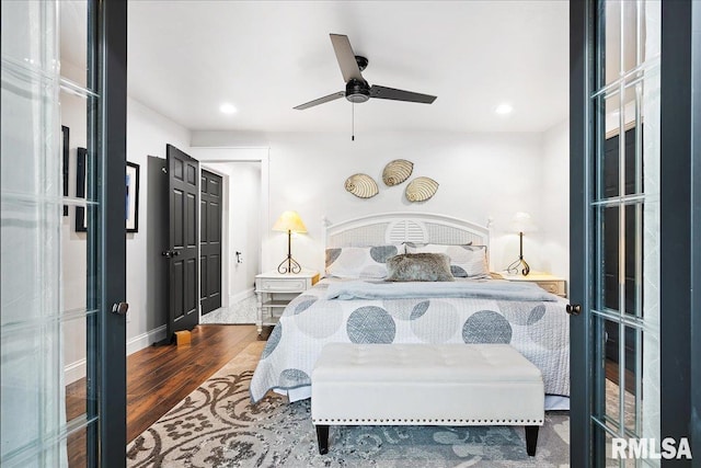 bedroom featuring baseboards, a ceiling fan, recessed lighting, and wood finished floors