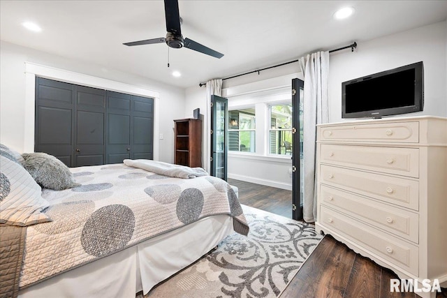bedroom featuring recessed lighting, ceiling fan, a closet, and dark wood-style flooring
