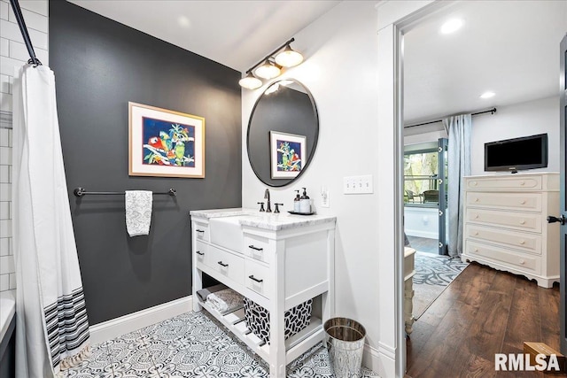 full bath with vanity, wood finished floors, baseboards, recessed lighting, and a shower with curtain
