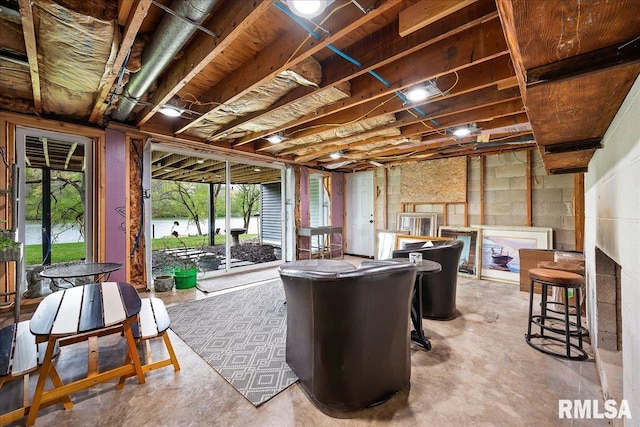 interior space with concrete block wall