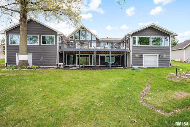 back of house featuring a wooden deck and a yard