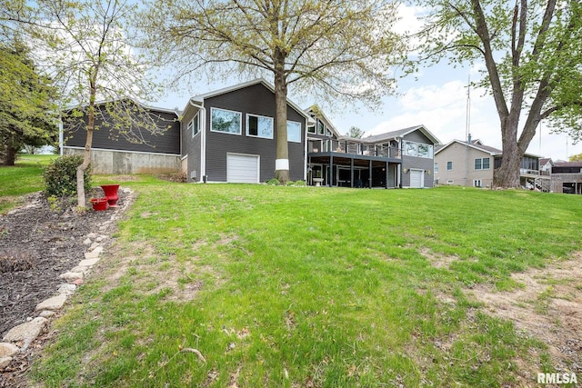 back of property featuring a lawn and a deck